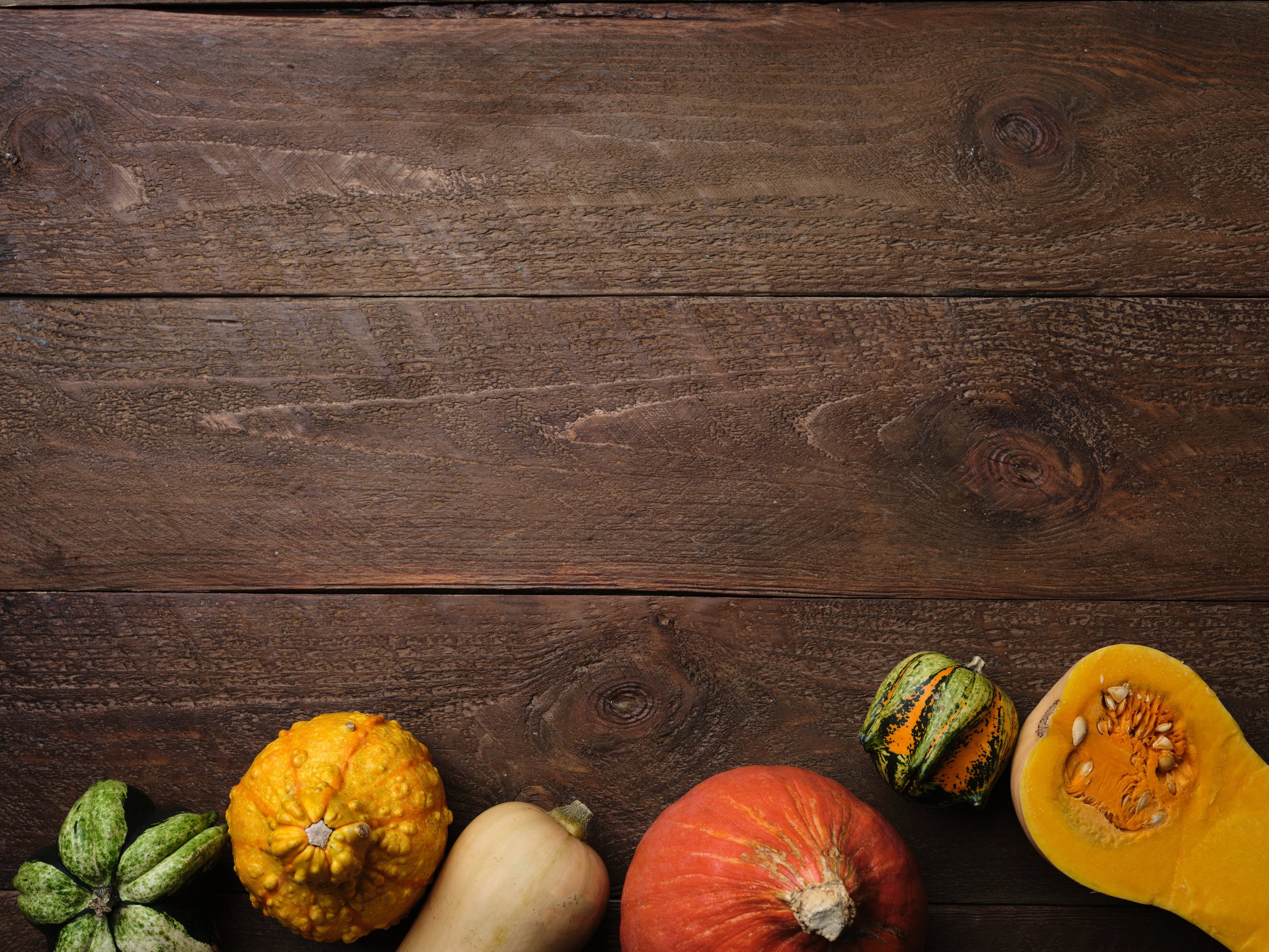 Fresh Pumpkins on Wooden Background